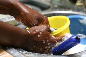 a person washing plates