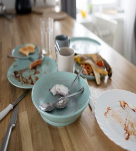 A Table with dirty greasy dishes